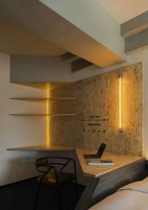 Contemporary workspace featuring metallic surfaces and minimalist design.