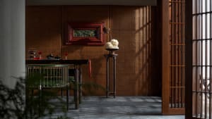 A beautifully designed living space featuring traditional wooden furniture and decor.