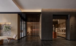 A modern office interior featuring concrete and wood materials.