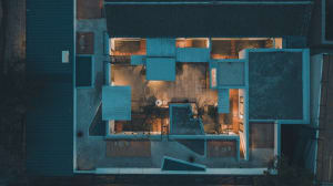 A modern residential building with concrete and wooden elements.