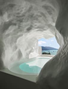 Concrete spa suite with a view of the sea and mountains