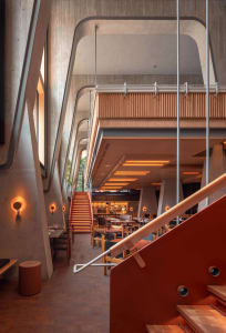 Industrial-style restaurant interior featuring concrete and timber materials