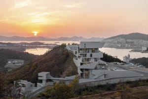 Modern residential building on a hillside constructed with concrete.