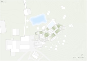 A detailed topographical map of a site with buildings, structures, and vegetation depicted in white on a pale green backgroun