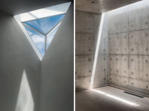 A minimalist interior with concrete walls and ceiling, featuring a skylight and natural light.