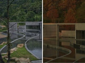A modern building with a curved concrete structure reflected in a pool of water.