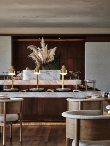 Marble dining tables in an industrial-style restaurant interior