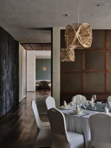 Contemporary-style restaurant interior with wood paneling and a mix of minimalist and natural elements.
