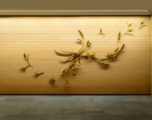 A minimalist interior design featuring wood and metal elements.