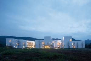 A modern residential community with white rendered stone exteriors