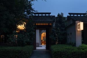 Traditional Chinese entryway featuring stone and wood materials.