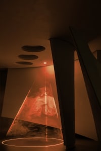 An abstract art installation featuring a cone-shaped light cone