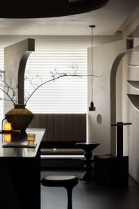 Modern interior design featuring concrete walls and minimalist furniture.