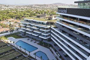 Modern residential condominiums featuring concrete and glass architecture