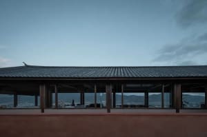 The image depicts the exterior roofline of a traditional building with a terrazzo roof.