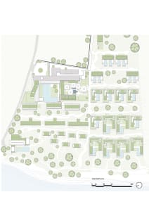 A detailed floor plan of a residential development showing various buildings, pathways, and green spaces.