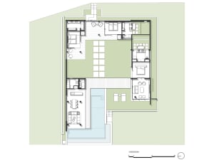 A residential floor plan featuring a layout with three bedrooms, a kitchen, and living areas.