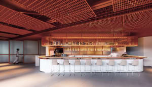 A minimalist bar counter with metal stools and a metal ceiling grid