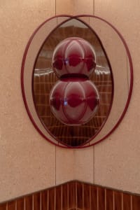 A minimalist glass artwork in a modern interior setting