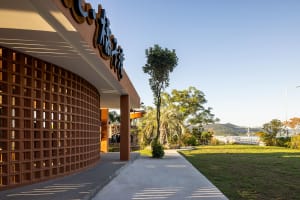 Modern exterior design featuring a brick wall with geometric patterns and clean lines.