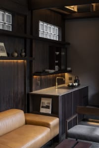 Industrial-style cafe interior with metallic finishes and functional bar area.