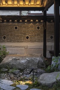 A traditional Japanese rock garden featuring large rocks and natural elements.
