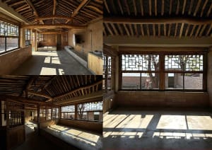 A modern interior space with wooden architectural elements and large windows.