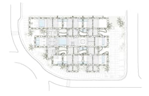 An urban design layout featuring mixed media materials with various buildings and pathways.