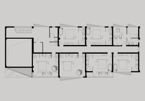 A modern residential floor plan depicting a house with four bedrooms, bathrooms, and a kitchen.