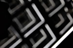 A glass floor plan showcasing an abstract geometric grid pattern.