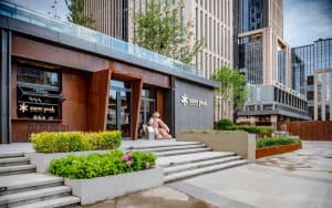 Modern storefront with concrete and metal elements.