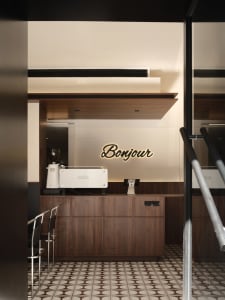 Modern cafe interior with wooden walls and a bar counter