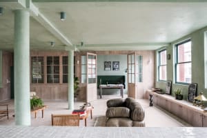 A modern living room featuring wooden furniture and decor.