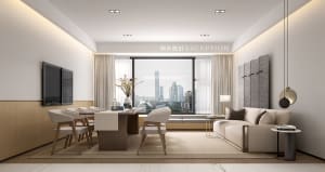 A modern living room with a neutral color palette featuring a white sofa, wooden table, and minimalist decor.