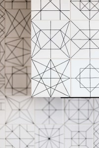 Geometric patterns on white tiles