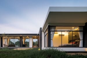 Modern bedroom with concrete and glass materials