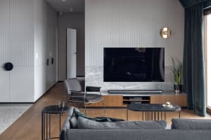 Modern living room featuring marble and metal accents, showcasing contemporary interior design principles.