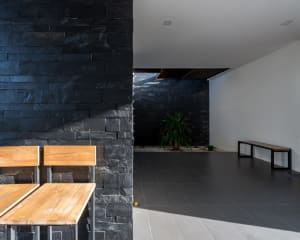 A modern lobby with concrete and stone materials.