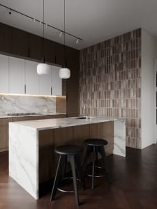 Modern kitchen with marble countertops and dark wooden cabinets.