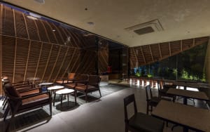 A restaurant interior with chairs and tables, creating an inviting atmosphere for socializing and dining