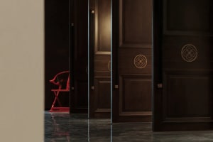 Wooden hallway with two chairs, doors on both sides, and a calm atmosphere