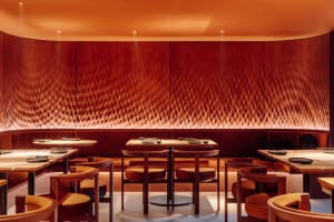 Cozy restaurant with brown tables and chairs, warm ambiance, and inviting atmosphere