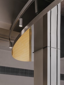 Modern lobby with a metal staircase, two side lights, and a contemporary design