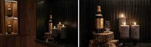 A cozy wine bar with a candle holder and a bottle of wine, lit candles creating a warm atmosphere