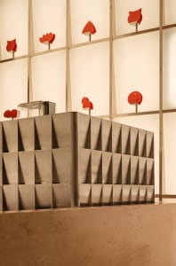 A silver structure with multiple shelves and compartments, adorned with red hearts, creating a unique and eye-catching atmosphere
