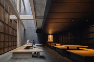 Cozy dining space with multiple tables and benches, natural light, and a relaxed atmosphere