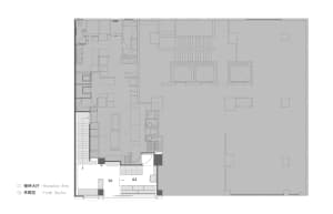 2D floor plan of a modern home with a kitchen, dining area, living room, and two staircases