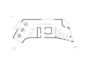 A modern office space with multiple chairs placed throughout a large open area, featuring a focus on functionality and comfort