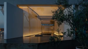 Open air living area with a large glass wall leading to a body of water, featuring two wooden benches and a serene atmosphere
