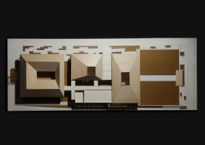 Architectural model of a grand wooden building with multiple rooms, windows, and detailed design elements